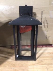 lot 44 image: Home Decorators Collection Mauvo Canyon Collection Black Outdoor Seeded Glass Dusk to Dawn Wall Lantern Sconce Open box