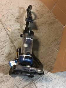 Eureka PowerSpeed Cord Rewind Upright Bagless Vacuum Cleaner with LED Headlights and Pet Turbo Tool Used in Working Conditions