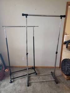 lot 150 image: Rolling Metal Clothing Racks Pair
