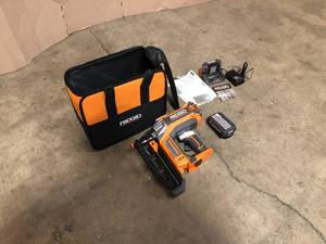 lot 31 image: 18V Brushless Cordless HYPERDRIVE 16-Gauge 2-12 in Straight Finish Nailer, 2 Ah Battery, Charger, Belt Clip and Bag by RIDGID