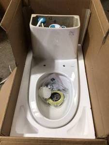 lot 37 image: Swiss Madison Ivy 10 in. Rough-In 1-Piece 1.11.6 GPF Dual Flush Elongated Toilet in White Seat Included - good condition - review all pictures