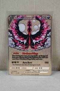 lot 41 image: Custom Metal Galarian Moltres V Pokemon Card