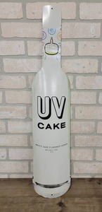 lot 1454 image: UV Vodka Metal Bottle Sign - 30 x 6