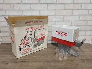 lot 1433 image: Vintage Trim Toys Coca-Cola Dispenser, w Original Box, Bottle and Cups