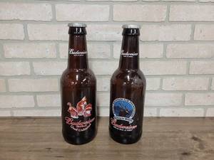 lot 1492 image: Pair of Large Glass Budweiser Bottles - Quail Unlimited and Rocky Mountain Elk Foundation - Each is 15 Tall