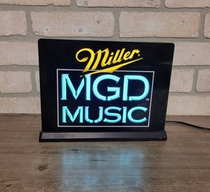 lot 1534 image: Miller MGD Music Lighted Bar Top Sign - 9.5 x 7.5 - WORKS
