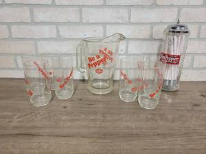 lot 1538 image: Nice Heavy Dr Pepper Glass Pitcher (9 Tall), 8 Dr Pepper Drinking Glasses and Glass Straw Holder