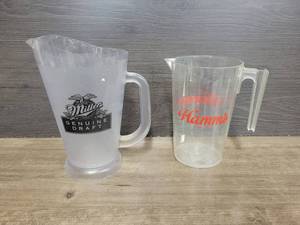 lot 1540 image: Miller Genuine Draft Plastic Pitcher (9 Tall) and Hamms Plastic Pitcher (7.5 Tall)