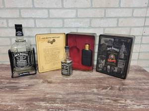 lot 1556 image: Jack Daniels Bottle Tipper, Tin w Bottle and Flask and Empty Tin