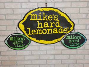 lot 1589 image: Mikes Hard Lemonade Metal Wall Sign - Yellow Lemon is 28 x 18
