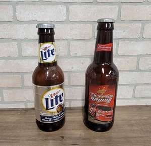 lot 1607 image: Pair of Oversize Beer Bottles - Budweiser is Glass (15 Tall) and Miller Lite is Plastic (14 Tall)