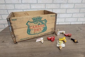 lot 1615 image: Vintage Canada Dry Crate (16 x 11 x 9) and (8) Vintage Bottle Stoppers (Seagrams, Old Smuggler, Kessler and More)