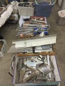 lot 352 image: TIE DOWN STAKES, GARAGE DOOR HARDWARE, TOTES AND MORE