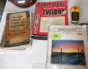 lot 58 image: Old plat book, car repair manual and a Garmin