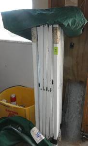 lot 74 image: EZ-Up canopy - green top, with storage bag with wheels