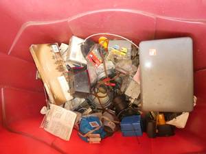 lot 101 image: Red tote full of electrical parts, weekly sprinkler timer