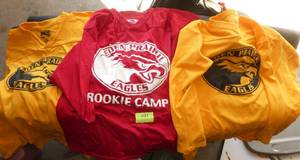 lot 103 image: Four Eden Prairie Eagles shirts