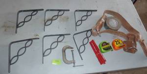 lot 151 image: 6 decorative new shelving brackets, leather tool belt, tape measures