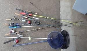 lot 156 image: Large group of fishing rods and reels and a couple nets