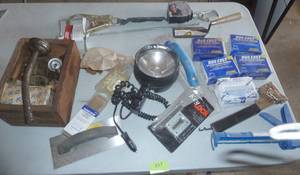 lot 157 image: Lot of staples (4 boxes full) stapler, caulk gun, light etc