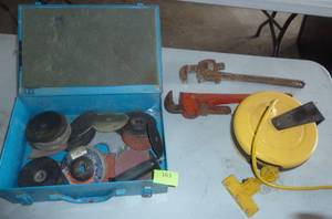 lot 163 image: bunch of sanding discs, pipe wrenches and hose reel