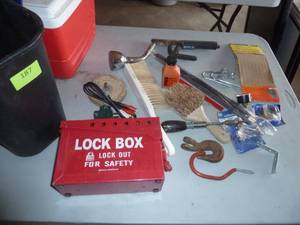 lot 187 image: waste basket with misc hardware and a Lock out box with locks