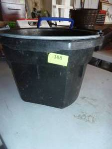 lot 188 image: rubber feed bucket with 100ft tape measure, roof clips and spacers (about 10 bags), big flashlight, parts bin, tent stakes, fishing weights