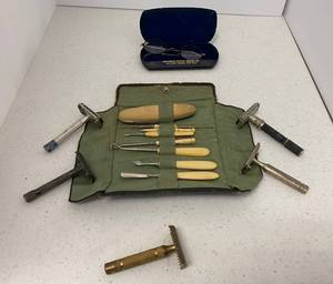 lot 24 image: Vintage Manicure set with Ivory Handles (Minnesota Residents Only).  Vintage Razors and Vintage Spectacles with unmarked 12K  frames.