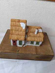 lot 493 image: Vintage Department 56 Heritage Village Collection The Cottage of Bob Cratchit and Tiny Tim Dickens Village Series