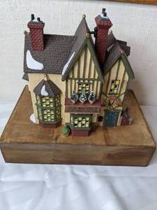 lot 489 image: Vintage Department 56 Heritage Village Collection J.D. Nichols Toy Shop Dickens Village Series