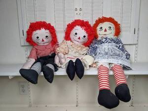 lot 28 image: Raggedy Andy and Pair of Raggedy Anns