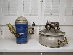 lot 30 image: Bob Andersen - Sunflower Pottery Collection, 1980s Casserole Dish (Tractor), Teapot-Grain Silo