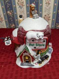 lot 211 image: Vintage Department 56 North Pole Series Christmas Critters Pet Store