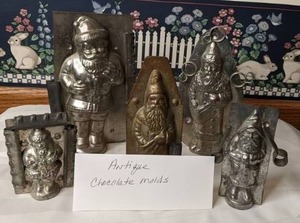 lot 627 image: Five Antique Chocolate Molds - Santa Clauses