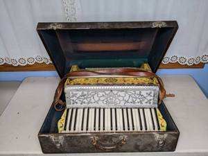 lot 2 image: Amazing Antique Accordion with Storage Case