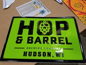 lot 512 image: Hop & Barrel Hudson WI Tin Sign