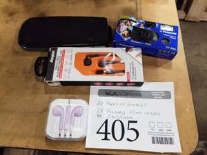 lot 405 image: Earbuds (in case), Energizer Tangle Free Flat Wire Earbuds (in original package), Polaroid 35mm Flash Camera, Texas Instruments TI-36X Pro Calculator