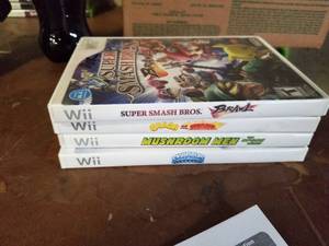 lot 437 image: Lot of (4) Wii Games - Super Smash Bros. Brawl, Crash of the Titans, Mushroom Men, Skylanders