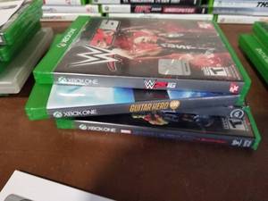 lot 446 image: Lot of (4) Microsoft XBox One Games - WWE Austin 2K16, Guitar Hero Live, Star Wars Battlefront, Marvel Guardians of the Galaxy