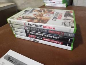 lot 454 image: Lot of (5) Microsoft Xbox 360 Games - Fight Night round 4, Fight Night Round 3, MMA, UFC 2009, Smack Down vs Raw 2007