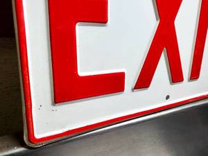 lot 79 image: Pressed Steel Exit Sign