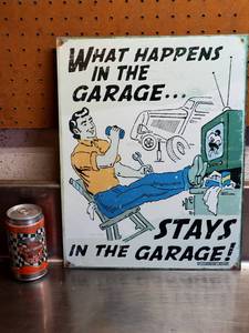 lot 124 image: What Happens in The Garage Tin Sign