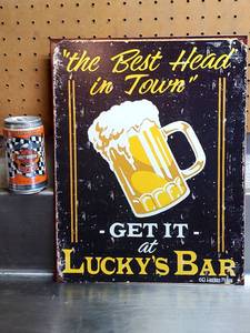 lot 125 image: Luckys Bar Tin Sign
