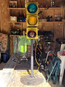 lot 81 image: Vintage Yellow Traffic Signal Mounted on a Metal Stand