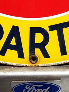 lot 233 image: 12 Round Chevrolet Parts Metal Sign