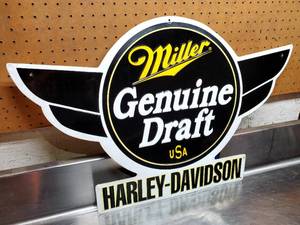 lot 204 image: Miller Genuine Draft Harley Davidson 31 W x 21 H Pressed Tin Sign