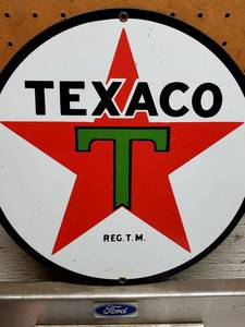 lot 206 image: 11 Round Texaco Metal Sign