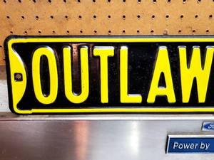 lot 229 image: Outlaw Ford Pressed Steel Sign