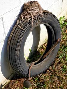 lot 258 image: Vintage Tire With Vintage Tools and Bird Nest Wall Decor Lot