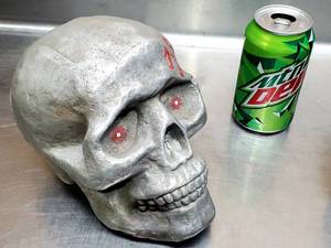 lot 213 image: (2) Aluminum Skulls Lot
